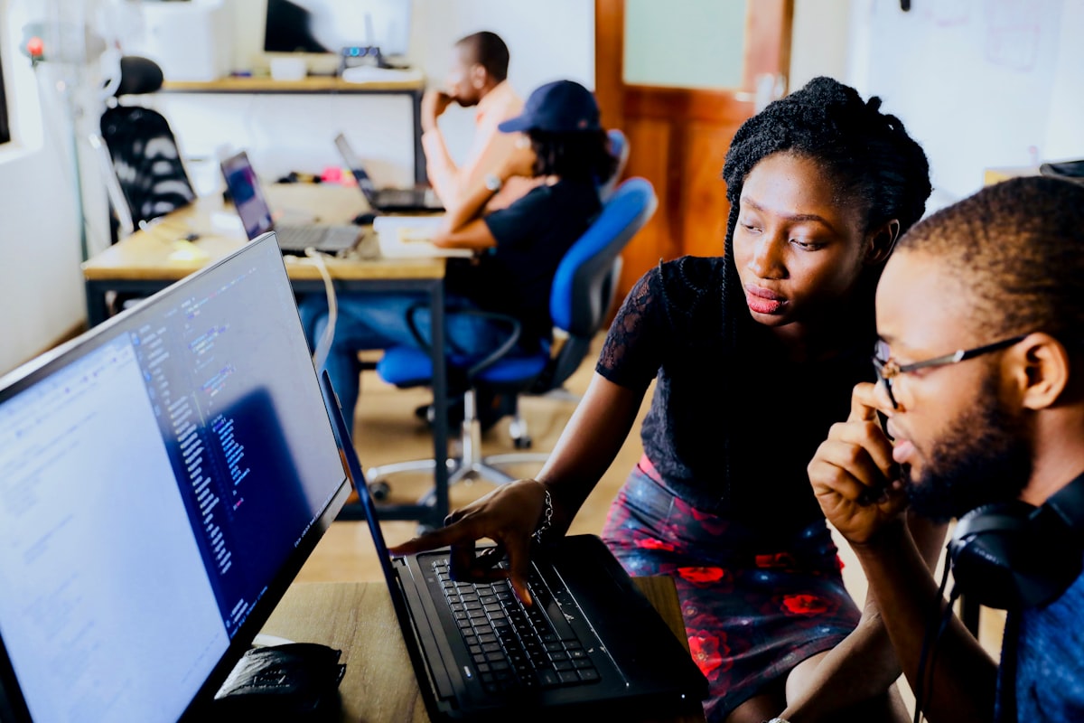 African developers collaborating on code